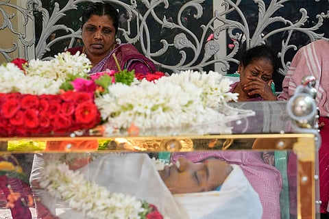 Stadium stampede: Relatives and friends pay tribute to a victim in Bengaluru