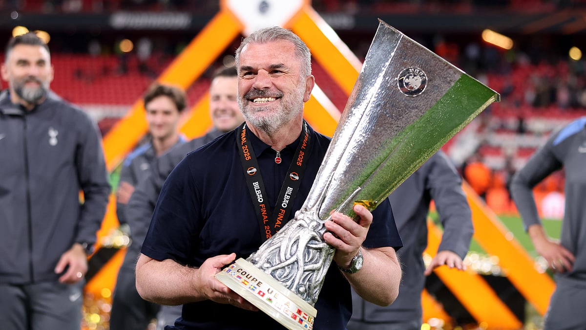 Ange Postecoglou lifting the Europa League trophy.
