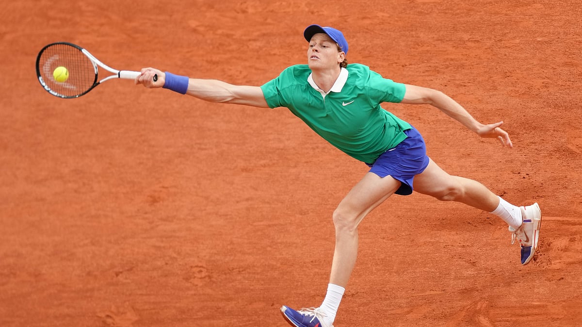 Italys Jannik Sinner plays a shot against Serbias Novak Djokovic. AP