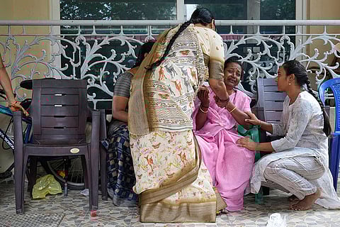 Stadium stampede: Relatives and friends pay tribute to a victim in Bengaluru