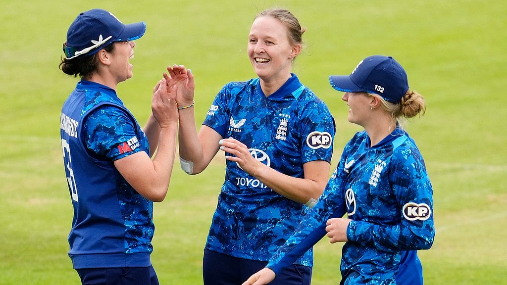AP : England's Lauren Filer (centre) celebrates taking the wicket of West Indies' Jannillea Glasgow during the third women's One Day International in Taunton.