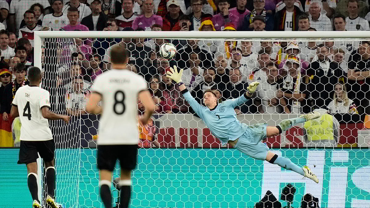 AP Photo/Matthias Schrader : Germany's goalkeeper Marc-Andre ter Stegen fails to save a shot by Portugal's Francisco Conceicao during the Nations League semifinal football match in Munich, Germany.