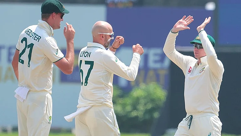 SL vs AUS 2nd Test Day 1: Australia's Nathan Lyon celebrates the wicket of Sri Lanka's Dimuth Karunaratne - | Photo: AP/Lahiru Harshana