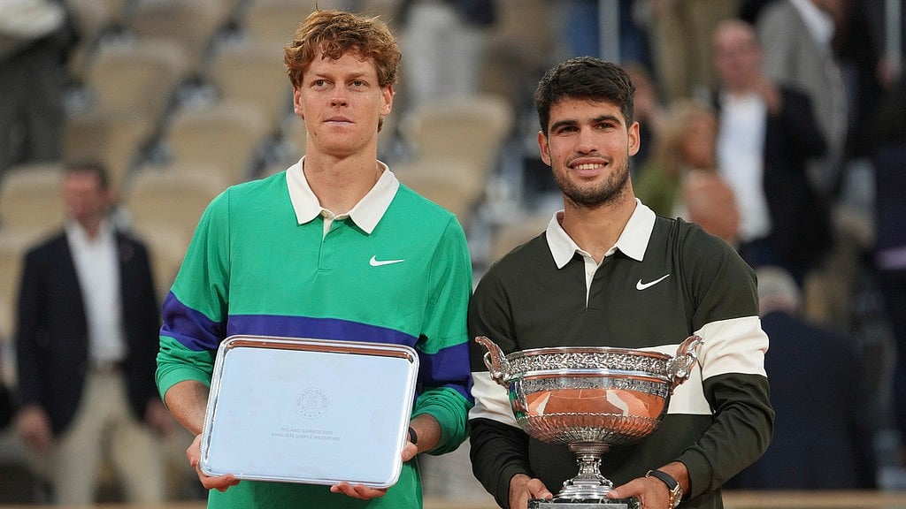 Photo: AP : Winner Spain's Carlos Alcaraz, right, and second-placed Italy's Jannik Sinner pose with trophies after the French Open final at the Roland-Garros stadium in Paris.