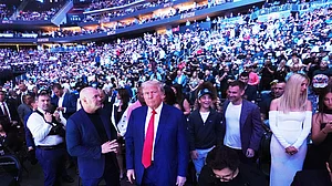 (AP Photo/Frank Franklin II) : President Donald Trump attends the UFC-316 mixed martial arts event, at the Prudential Center, Saturday, June 7, 2025, in Newark, N.J., as UFC's Dana White, looks on.