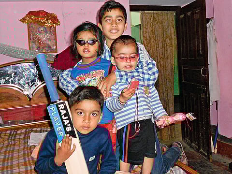 Vaibhav (holding the bat) along with his brothers and friends at his residence
