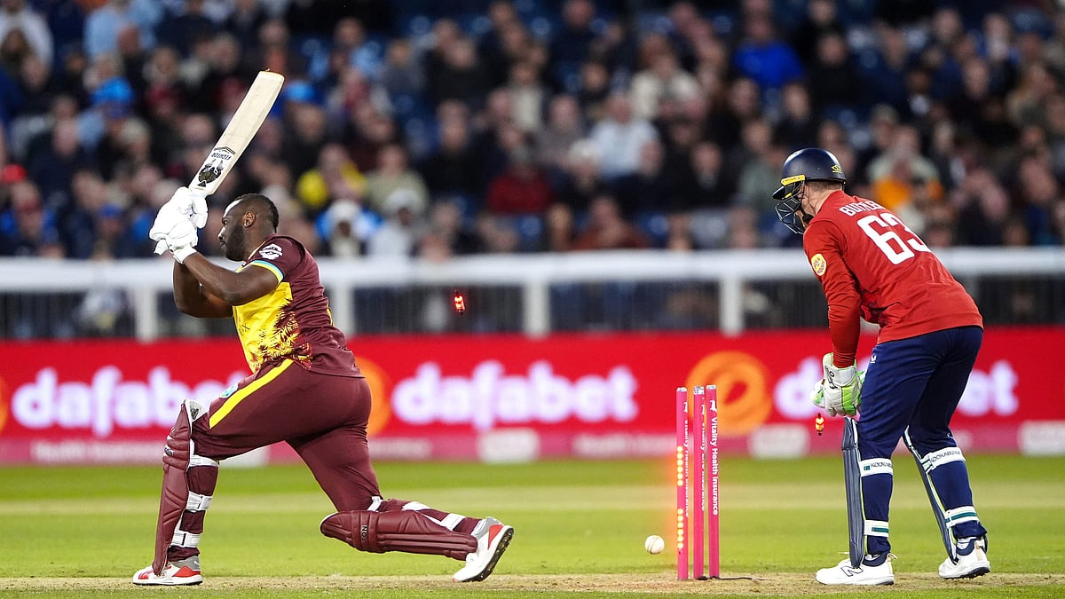 Owen Humphreys/PA via AP : West Indies' Andre Russell is bowled out by England's Jacob Bethell during the first men's international Twenty20 match at Banks Homes Riverside, Chester-le-Street.