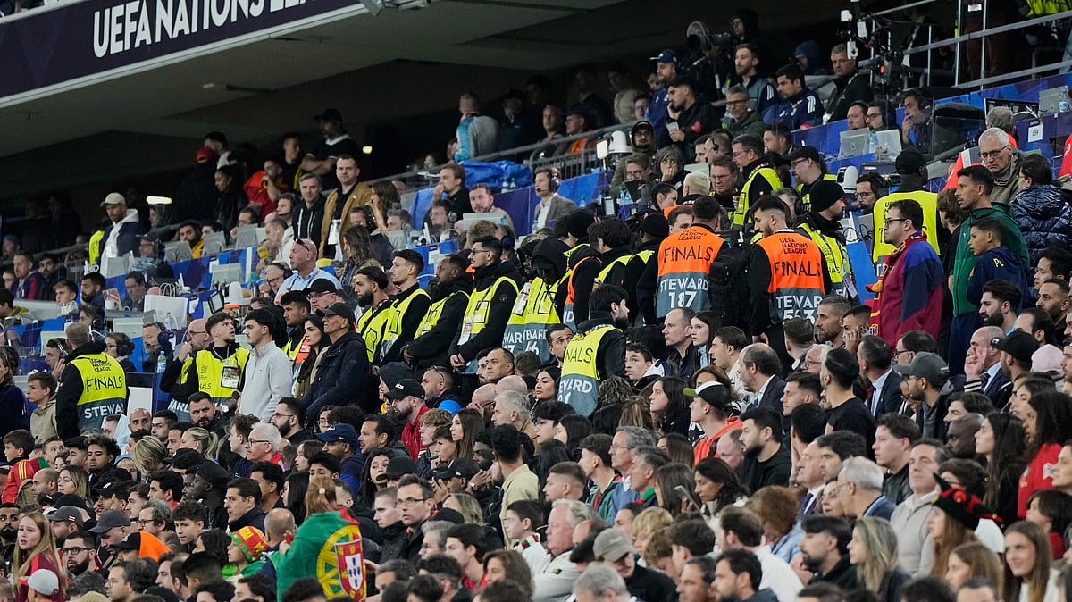 Match stewards form a line at the stands during the Nations League final soccer match between Portugal and Spain at the Allianz Arena in Munich, Germany, Sunday, June 8, 2025.  - (AP Photo/Martin Meissner)

