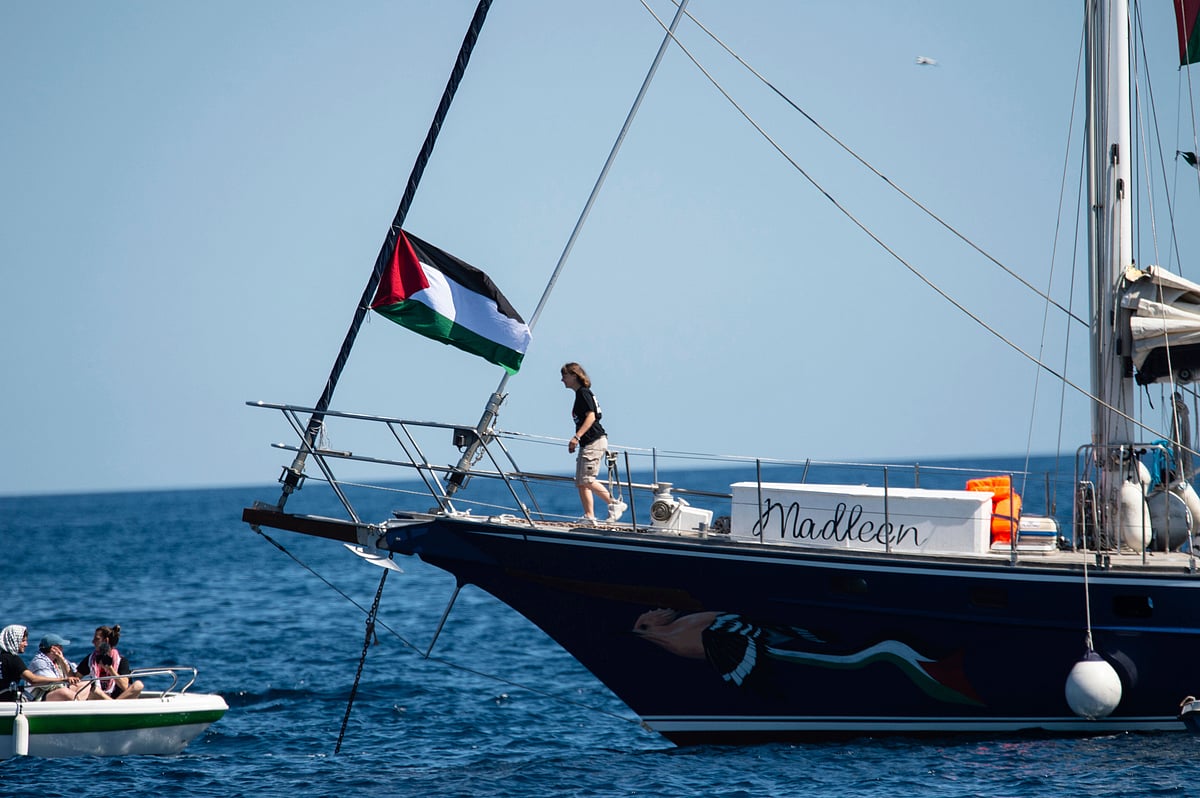 On Monday, Israeli naval commandos surrounded the 18-metre boat Madleen in international waters 160 kilometres off Gaza. Videos livestreamed only minutes earlier showed volunteers in orange life jackets as speedboats, flood-lights and shouted orders cut through the dark - Salvatore Cavalli: AP