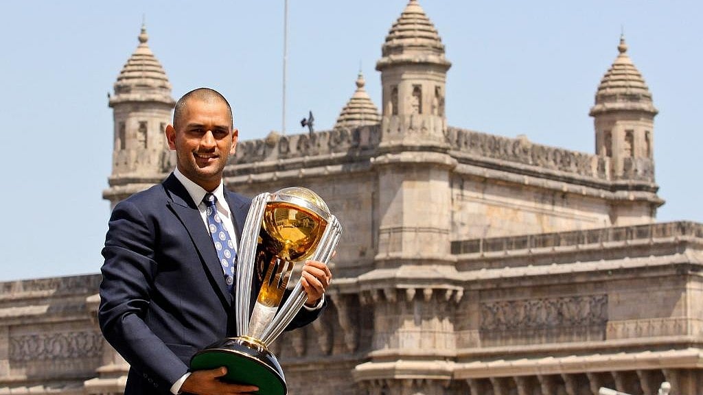 MS Dhoni with the ICC Cricket World Cup trophy - X/ICC