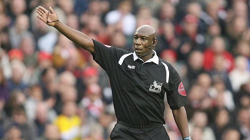 Premier League referee Uriah Rennie gestures in Liverpool, England