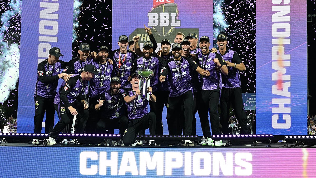 X | Big Bash League  : Hobart Hurricanes at the stage with BBL trophy. 