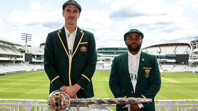 Australia captain Pat Cummins (R) with South Africa skipper Temba Bavuma with the Test mace
