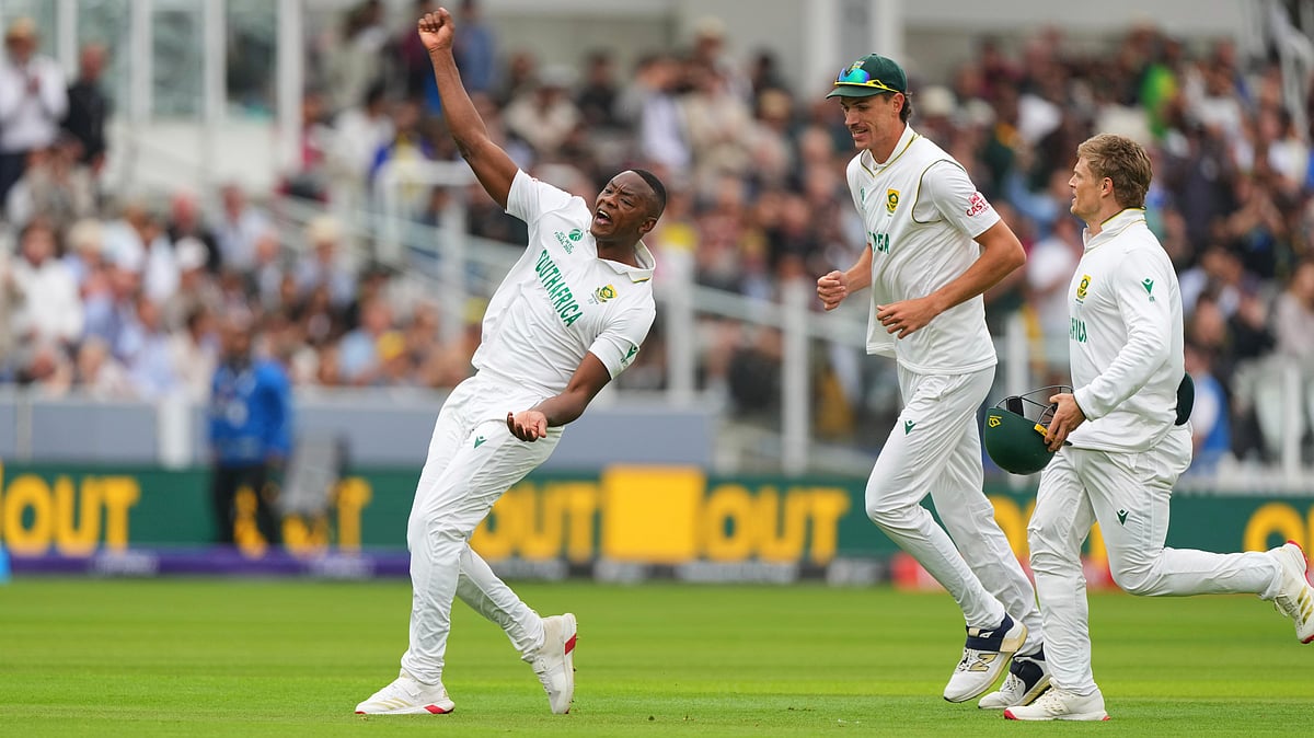 | Photo: AP Photo/Kirsty Wigglesworth : South Africa's Kagiso Rabada, left, celebrates the dismissal of Australia's Usman Khawaja during the World Test Championship final between South Africa and Australia at Lord's cricket ground in London (
