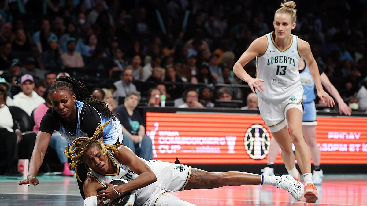 Jaylyn Sherrod #0 of the New York Liberty battles Michaela Onyenwere #12 of the Chicago Sky