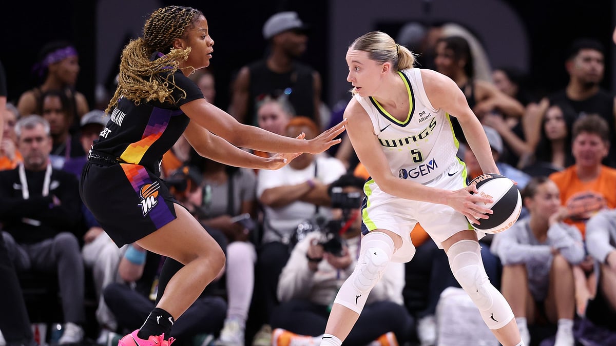 Paige Bueckers #5 of the Dallas Wings controls the ball against Monique Akoa Makani #8 of the Phoenix Mercury during the second half of a WNBA Commissioner's Cup game at PHX Arena on June 11, 2025 in Phoenix, Arizona.