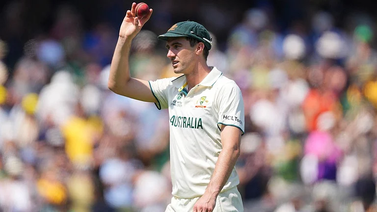 Pat Cummins holds up the ball to celebrate his six-wicket haul on day two of the World Test Championship final between South Africa and Australia at Lord's cricket ground in London. - AP/Kirsty Wigglesworth