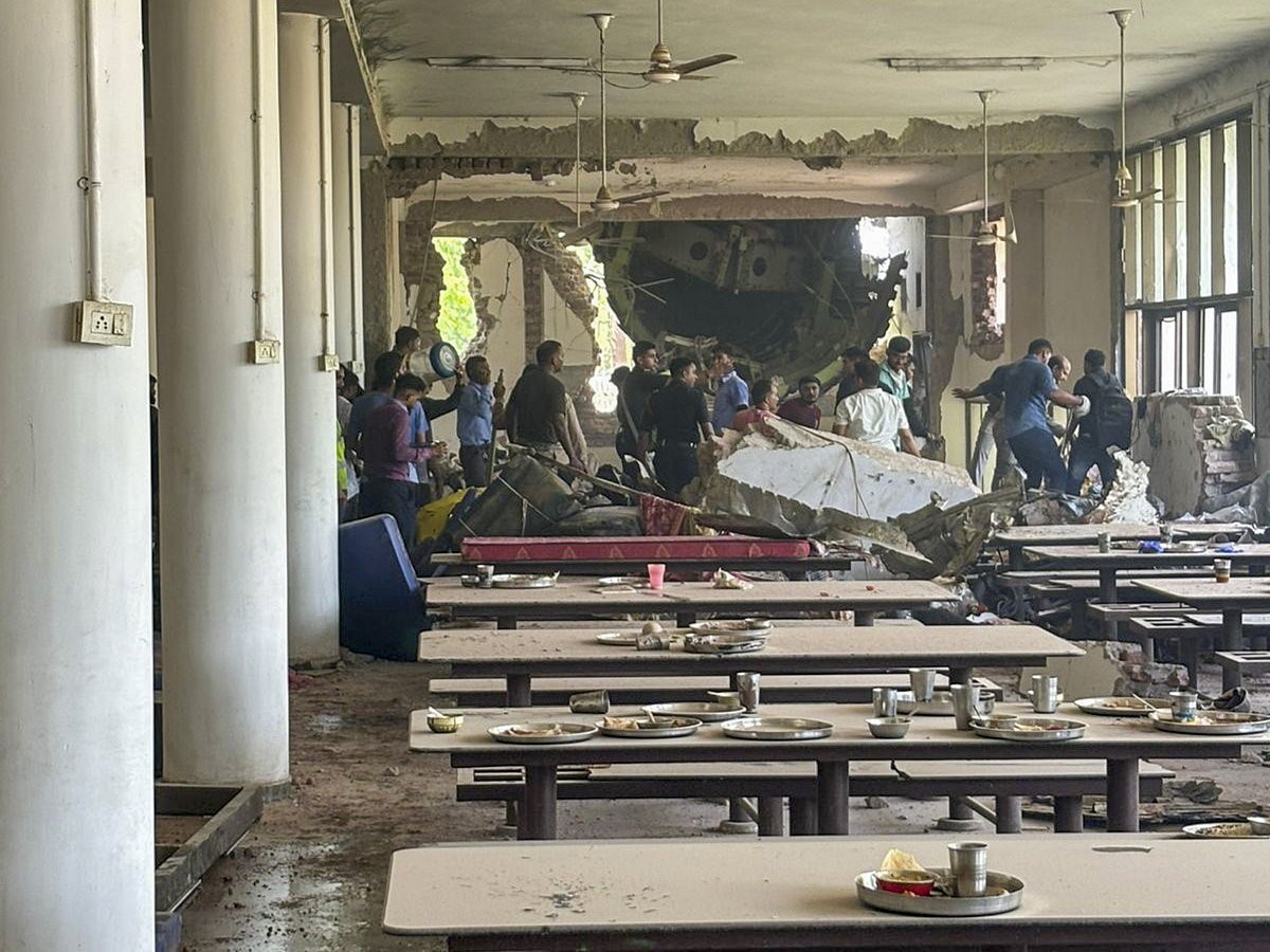 PTI : Damage at a building after an Air India plane crashed moments after taking off from the airport