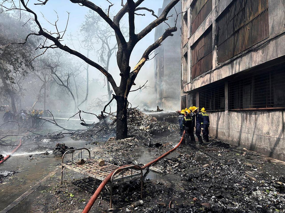 AP Photo/Ajit Solanki : Firefighters  at the site of the Boeing Dreamliner crash in Ahmedabad 