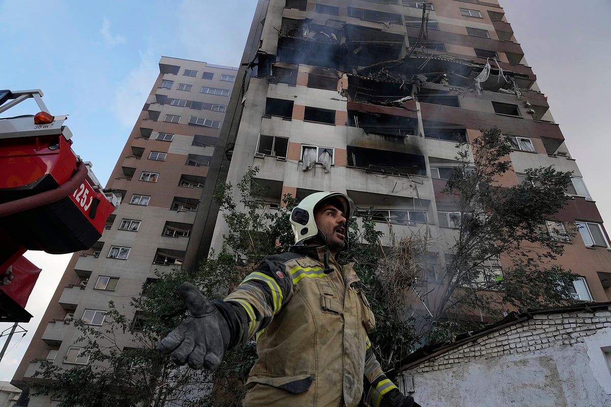 AP Photo/Vahid Salemi : A firefighter in Tehran where Israel air-striked on June 13,2025