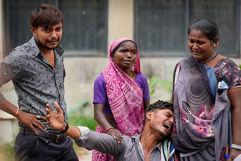 | Photo: PTI/Kunal Patil : Ahmedabad plane crash: Victim's family mourns