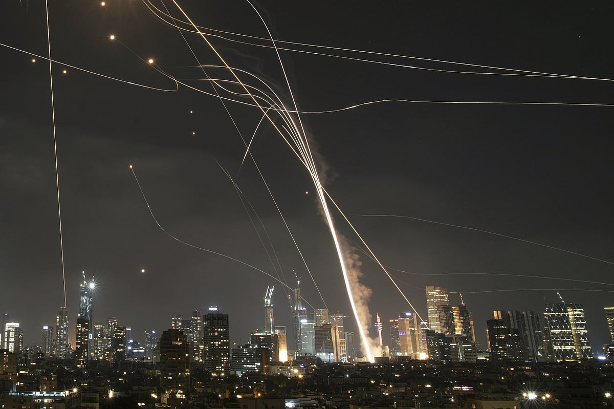 An Iranian projectile hit buildings over Tel Aviv on June 13, 2025 - AP Photo/Leo Correa