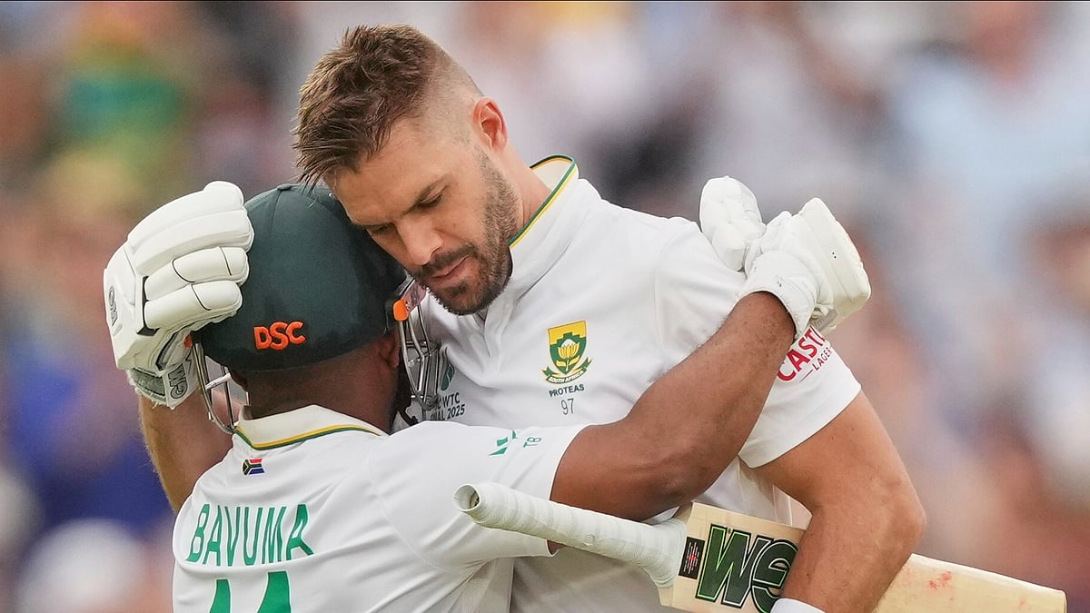 South Africa's Aiden Markram, right, celebrates with batting partner Temba Bavuma after scoring a century on day three of the World Test Championship final between South Africa and Australia at Lord's cricket ground in London, Friday, June 13, 2025.  - (AP Photo/Kirsty Wigglesworth)