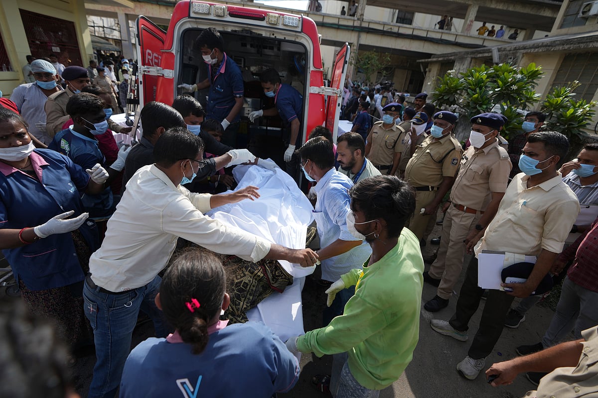 Ambulances take the deceased to Ahmedabad Civil Hospital for identification - AP