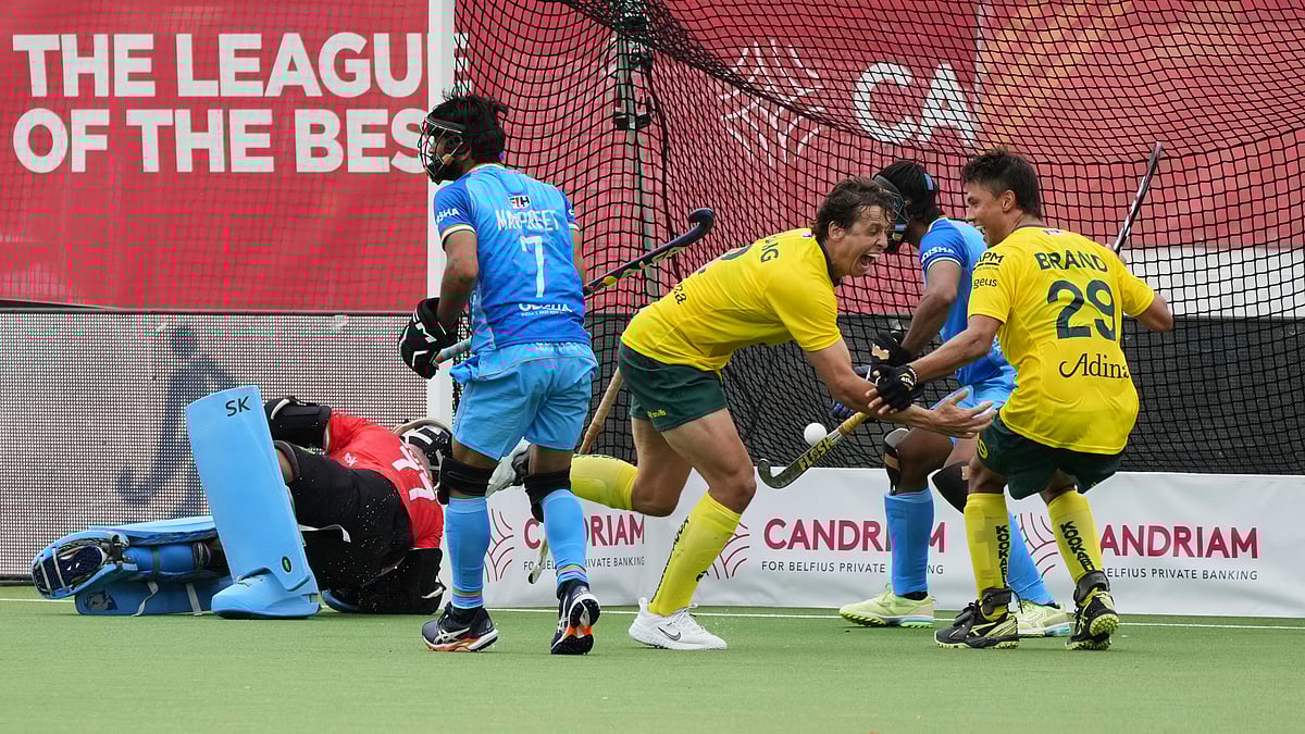 | Photo: AP/Virginia Mayo : Australia's Tom Craig, center, scores during the FIH Hockey Pro League game between Australia and India at the Wilrijkse Plein in Antwerp, Belgium, Saturday, June 14, 2025.