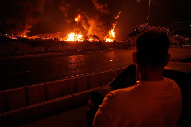 Flames rising in Tehran after an Israeli strike on June 15, 2025