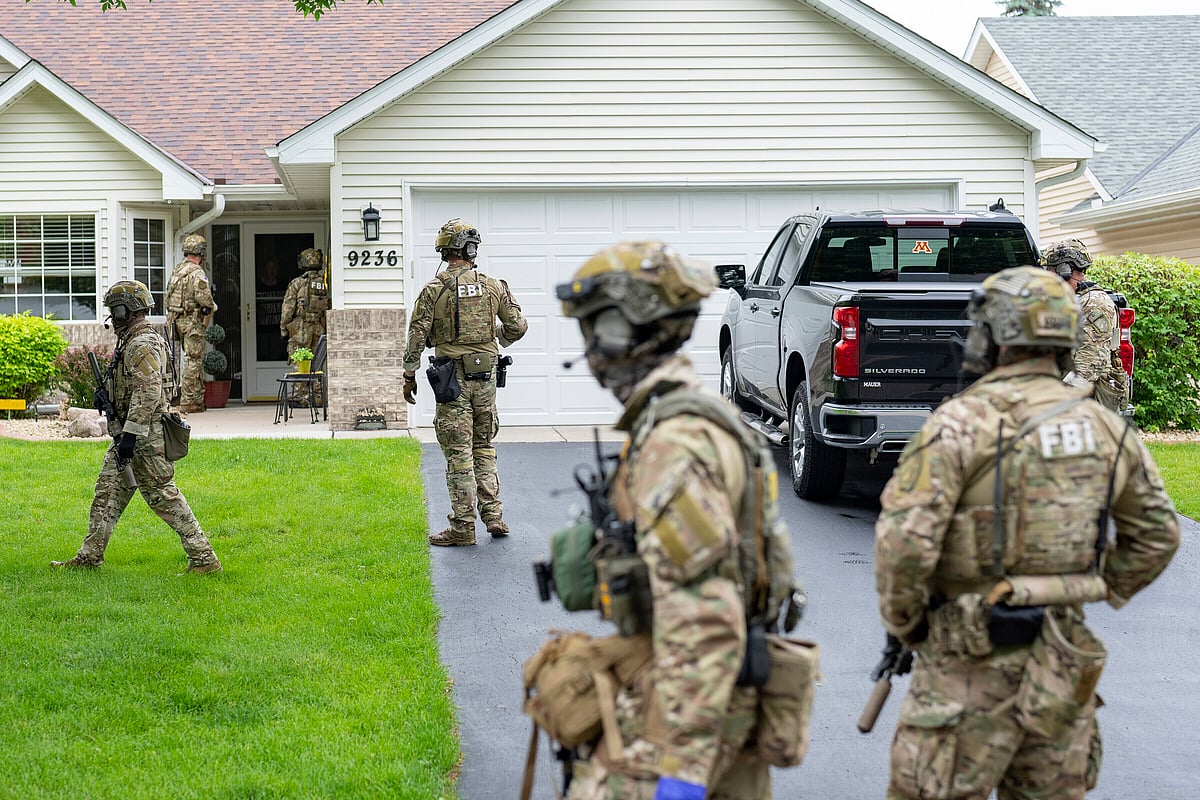 Alex Kormann/AP Photos : Armed FBI agents search for an active shooter, sweeping a neighborhood adjacent to the home of Minnesota DFL State Representative Melissa Hortman, in Brooklyn Park, Minn., Saturday, June 14, 2025. 