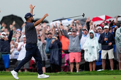 J.J. Spaun celebrates after sinking a birdie