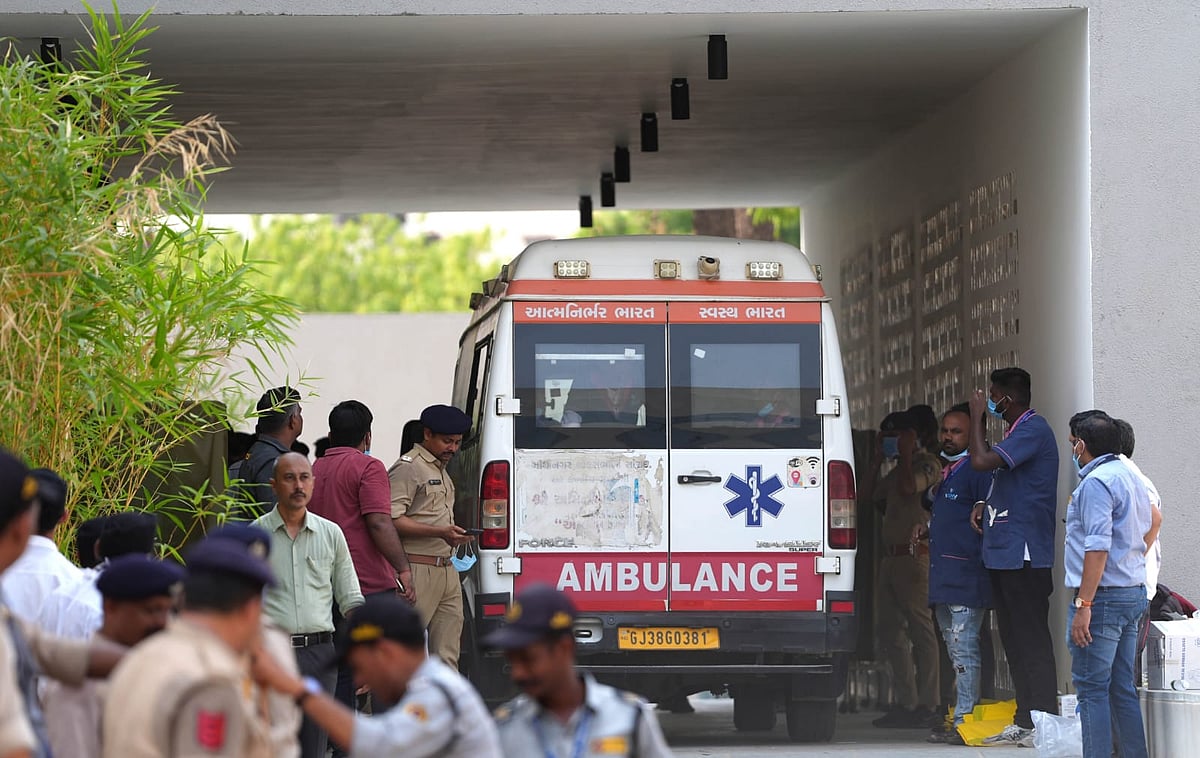 An ambulance carrying the body of one of the victims of the airplane crash arrives at Mortuary Complex in Civil Hospital, Ahmedabad - Dinesh Parab for Outlook