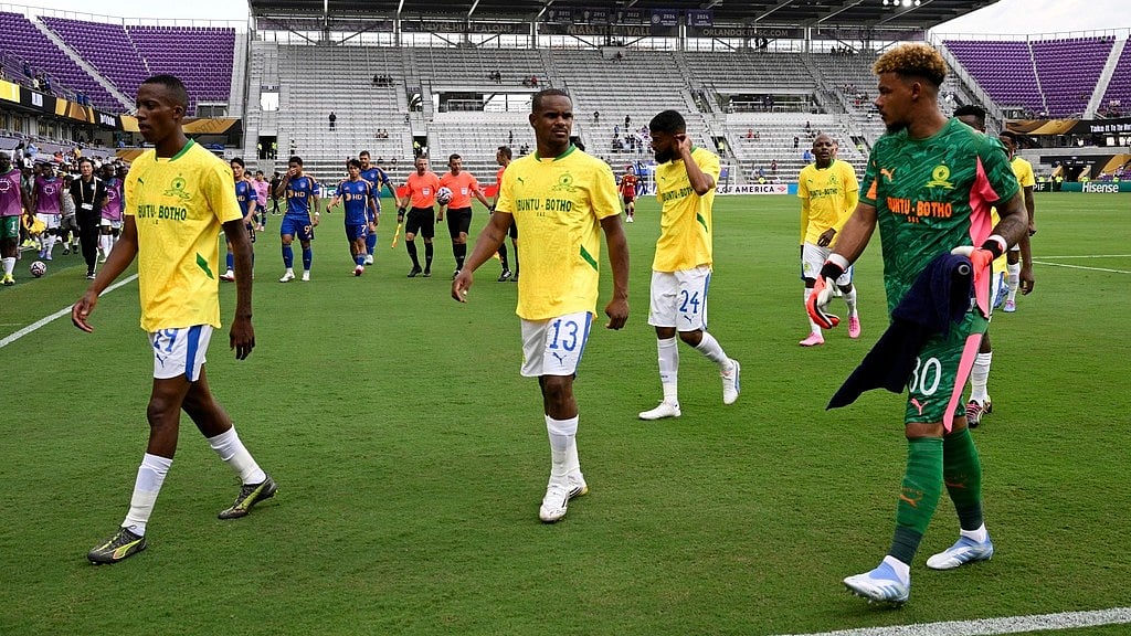 AP : Players from both teams leave the pitch for a weather delay before the FIFA Club World Cup group F match between Ulsan HD and Mamelodi Sundowns in Orlando, Florida.