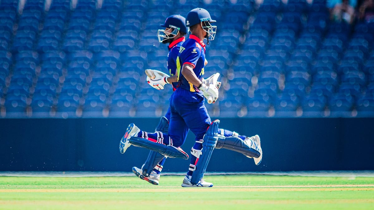 | Photo: X/Cricket Association Of Nepal : Nepal Batters Run Between Wickets Against Netherlands at Titwood, Glasgow