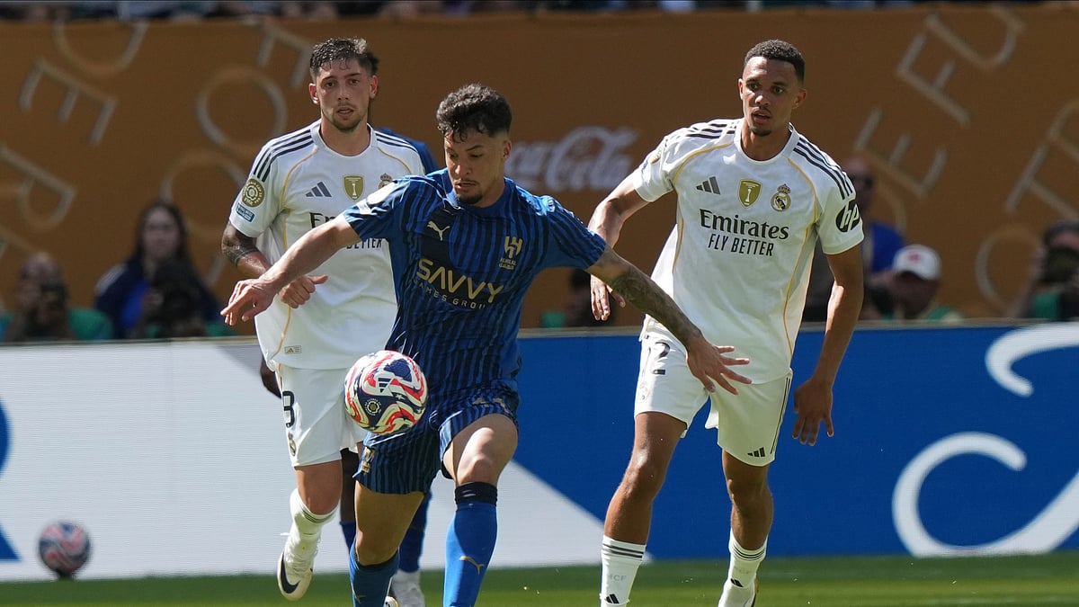 AP Photo/Lynne Sladky : Al-Hilal's Marcos Leonardo, left, controls the ball as Real Madrid's Trent Alexander-Arnold, right, looks on during the Club World Cup group H football match between Real Madrid and Al Hilal in Miami.