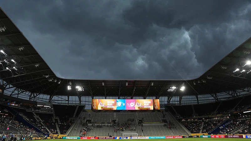 Storm clouds move over the stadium during the Club World Cup. AP