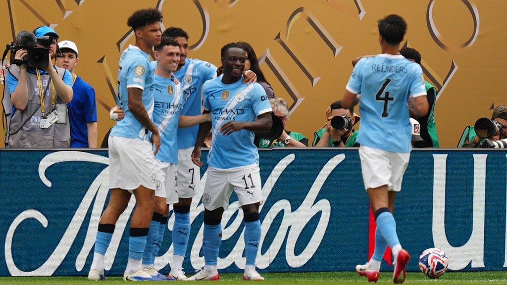 AP : Manchester City players celebrate the opening goal by Phil Foden, second from left, during the FIFA Club World Cup group G match against Wydad AC in Philadelphia.