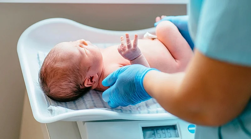 A baby on weighing scale