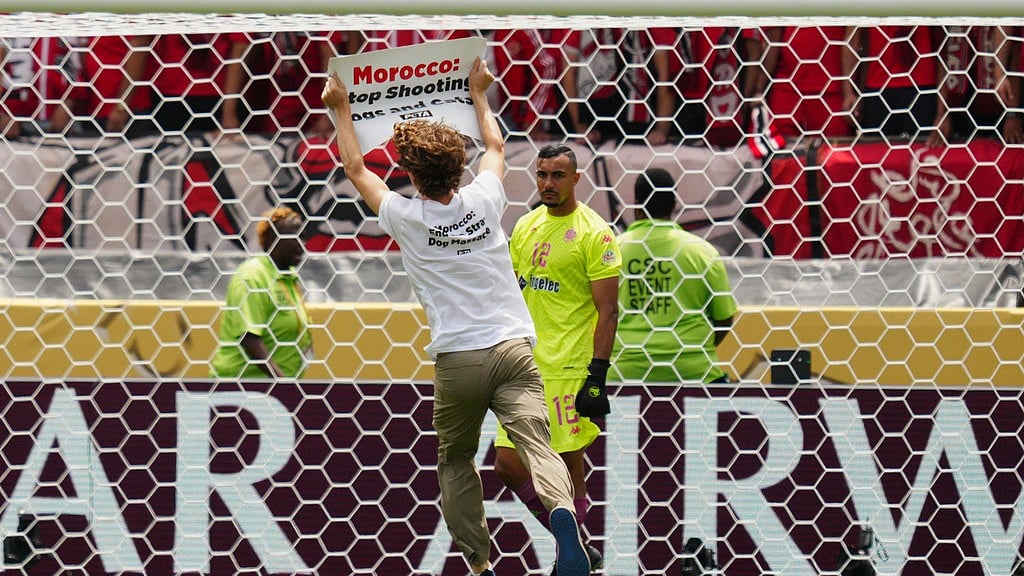 AP : A protester runs on the pitch during the FIFA Club World Cup group G match between Manchester City and Wydad AC in Philadelphia.