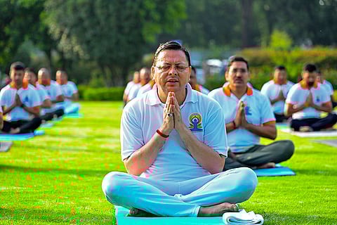 Pushkar Singh Dhami performs yoga