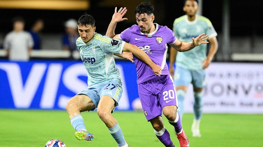 AP : Juventus' Andrea Cambiaso, left, and Al Ain's Matias Palacios battle for the ball during the Club World Cup group G soccer match between Al Ain and Juventus in Washington