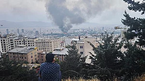 | Getty Images | : Smoke rises after a reported Israeli strike on a building used by Islamic Republic of Iran News Network, part of Iran's state TV broadcaster, on June 16, 2025 in Tehran, Iran.