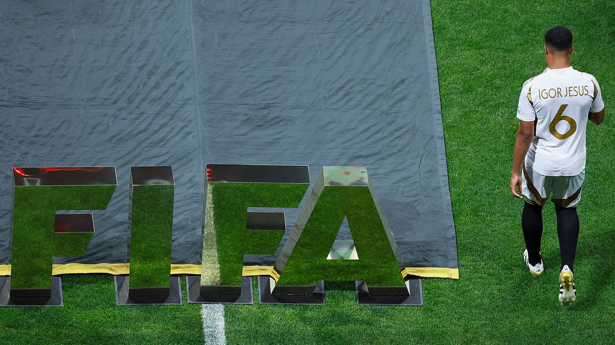 | Photo: Jason Getz/Atlanta Journal-Constitution via AP : LAFC vs ES Tunis, FIFA Club World Cup 2025: Los Angeles FC midfielder Igor Jesus walks by a FIFA sign as players from Chelsea and Los Angeles FC are introduced before a Club World Cup Group D soccer match in Atlanta, Monday, June 16, 2025. 