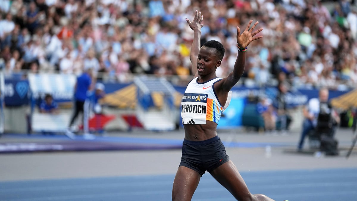 (AP Photo/Thibault Camus) : Faith Cherotich, of Kenya, crosses the finish line to win the women 3000 meters steeplechase during the Meeting de Paris Diamond League athletics meet at Stade Charlety in Paris, Friday, June 20, 2025.