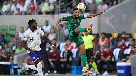 Saudi Arabia's Abdulelah Alamri (4) moves the ball past United States' Patrick Agyemang (24) during a CONCACAF Gold Cup soccer match.
