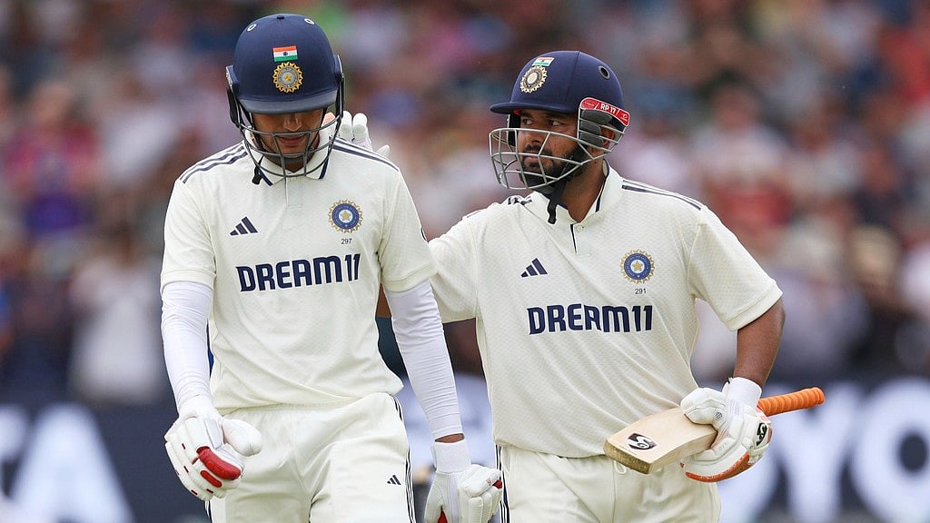 AP : India Vs England, 1st Test Day 2: Captain Shubman Gill (left) walks off the field after losing his wicket as he receives a pat from batting partner Rishabh Pant at Headingley in Leeds on Saturday, June 21.