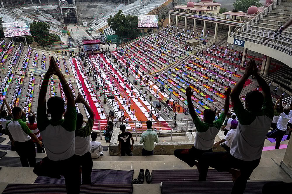 | Photo: PTI/Shiva Sharma : IDY 2025: Yoga session at Attari-Wagah Border