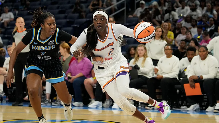 Kahleah Copper #2 of the Phoenix Mercury dribbles the ball against Ariel Atkins #7 of the Chicago Sky during the third quarter at Wintrust Arena on June 21, 2025 in Chicago, Illinois. - null