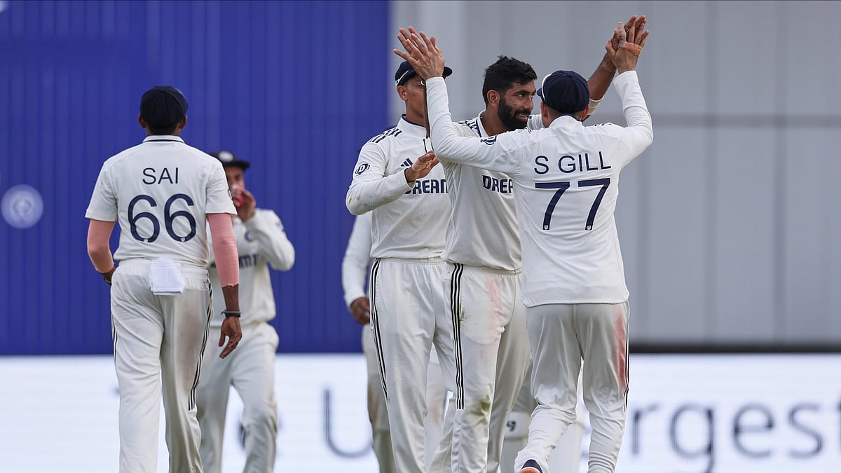 Indias Jasprit Bumrah, second right, celebrates with teammates. AP